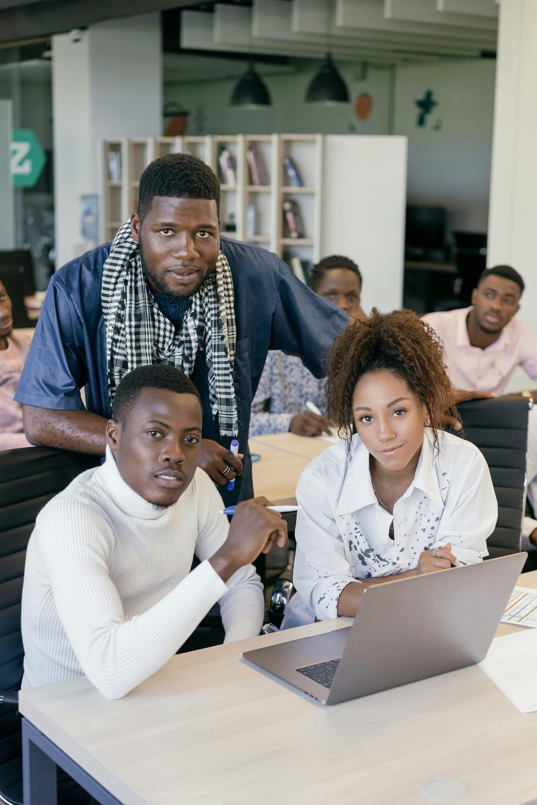 IMAGE OF A TEAM POSING FOR A PHOTO